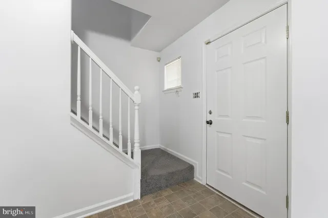 a view of a hallway with staircase