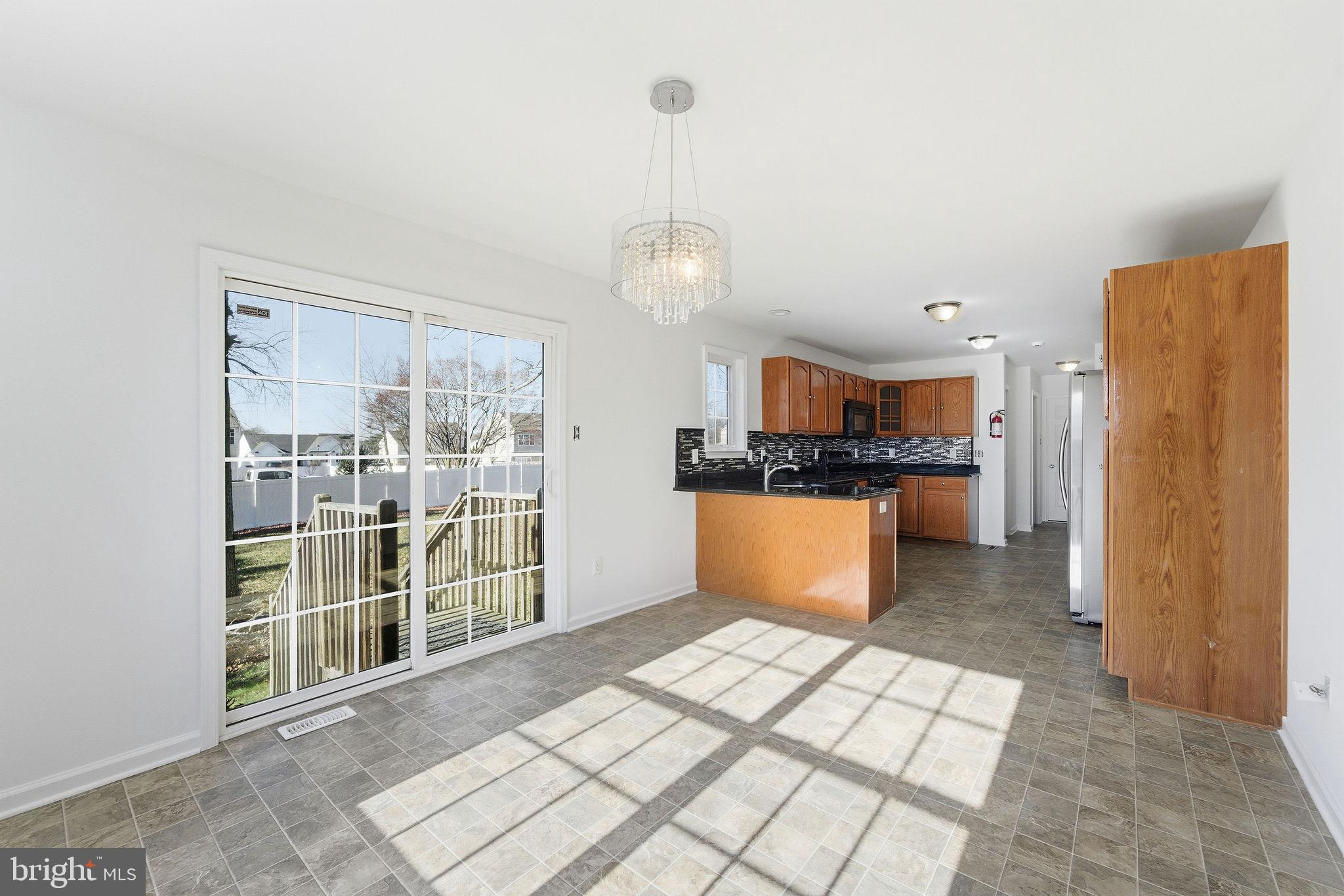 92 North Burlington Road Bridgeton, NJ 08302 - Photo 9 of 24 a view of kitchen with granite countertop cabinets and refrigerator