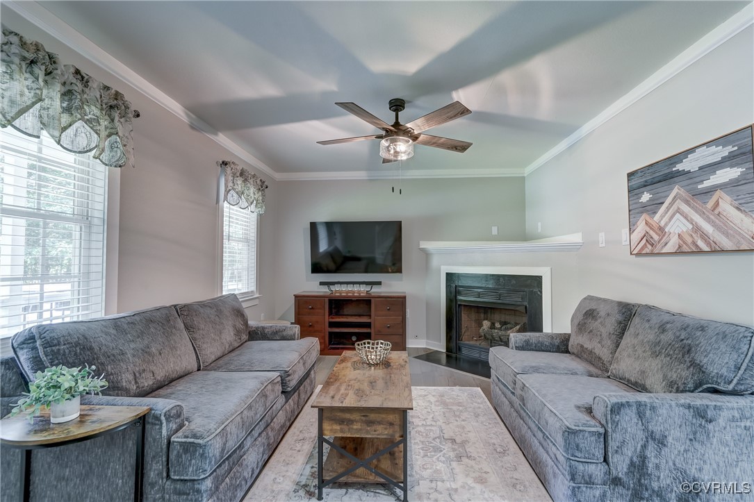 3335 Pleasants Road Powhatan, VA 23139 - Photo 3 of 34 Living room with crown molding, a fireplace, wood