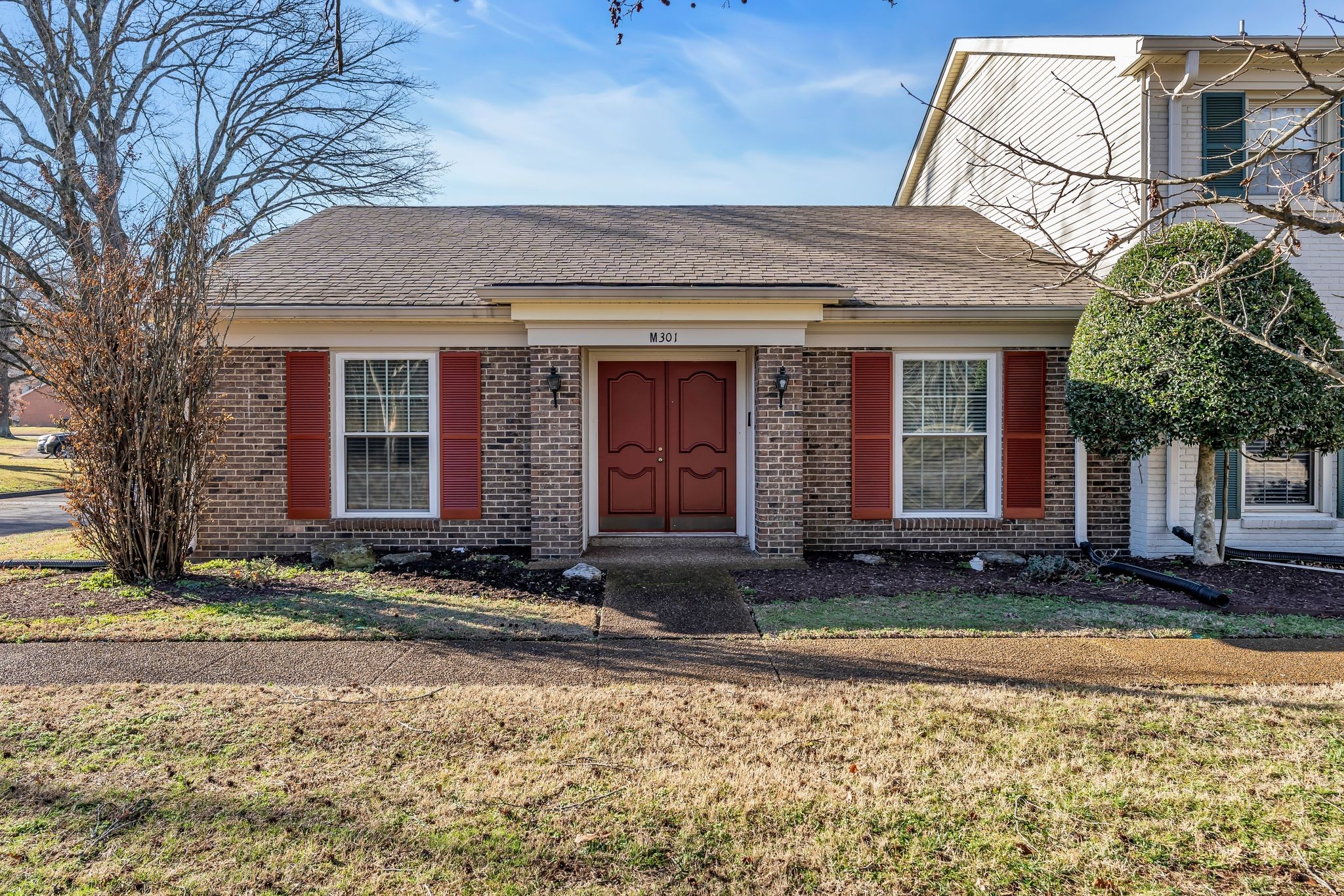 a front view of a house with a yard