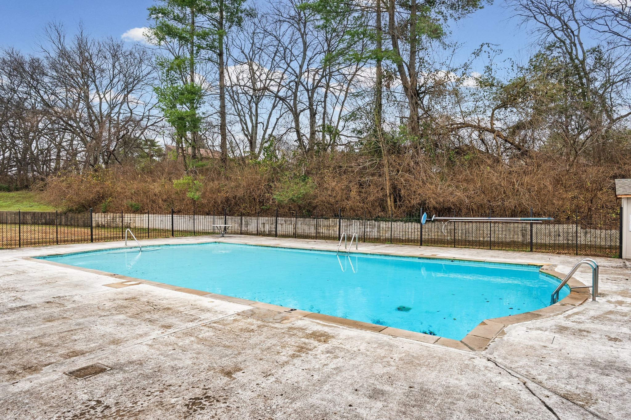 8300 Sawyer Brown Road, Unit M301 Nashville, TN 37221 - Photo 36 of 36 a view of a swimming pool with an outdoor space and seating area