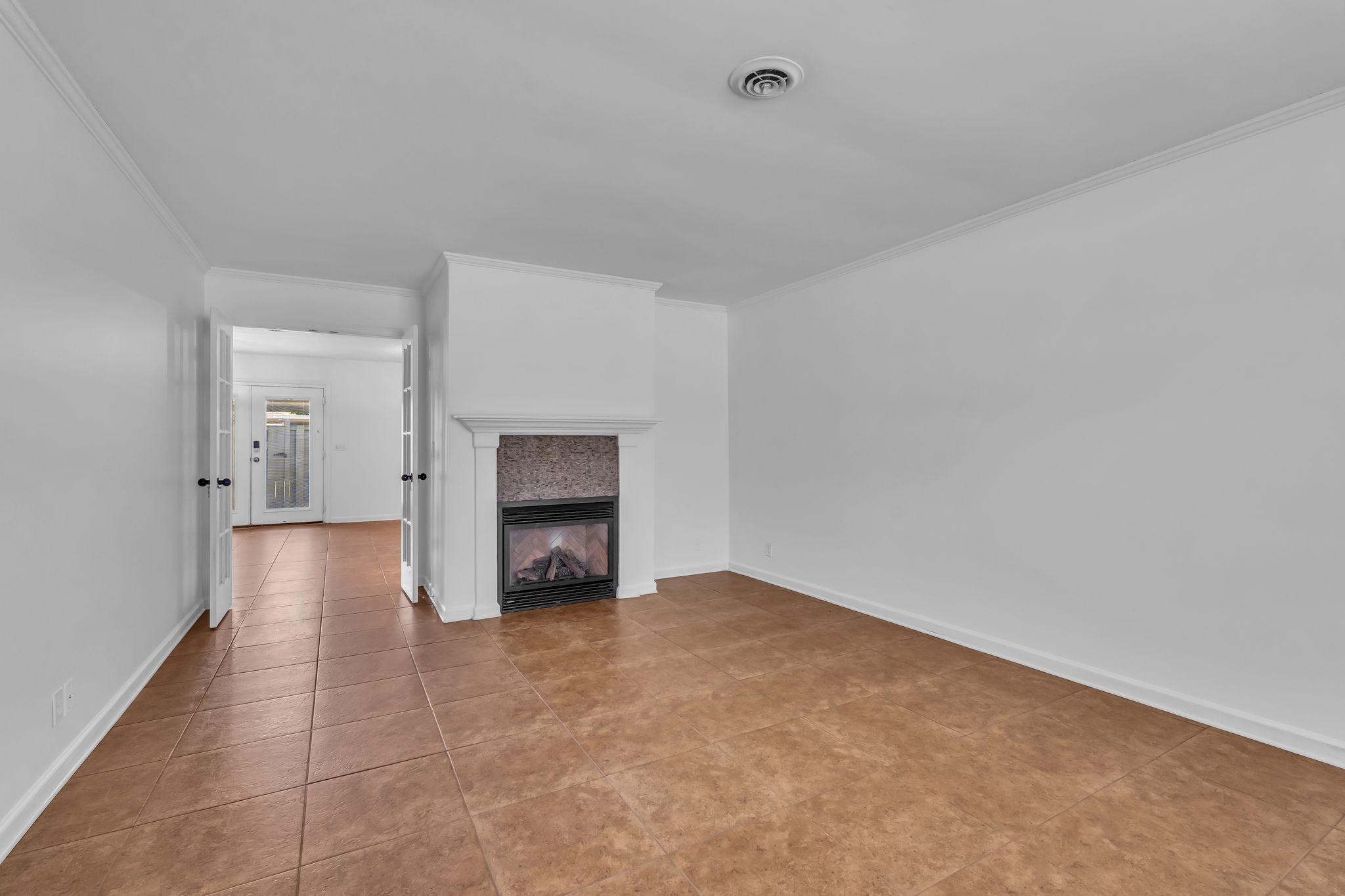 8300 Sawyer Brown Road, Unit M301 Nashville, TN 37221 - Photo 7 of 36 a view of an empty room with a fireplace