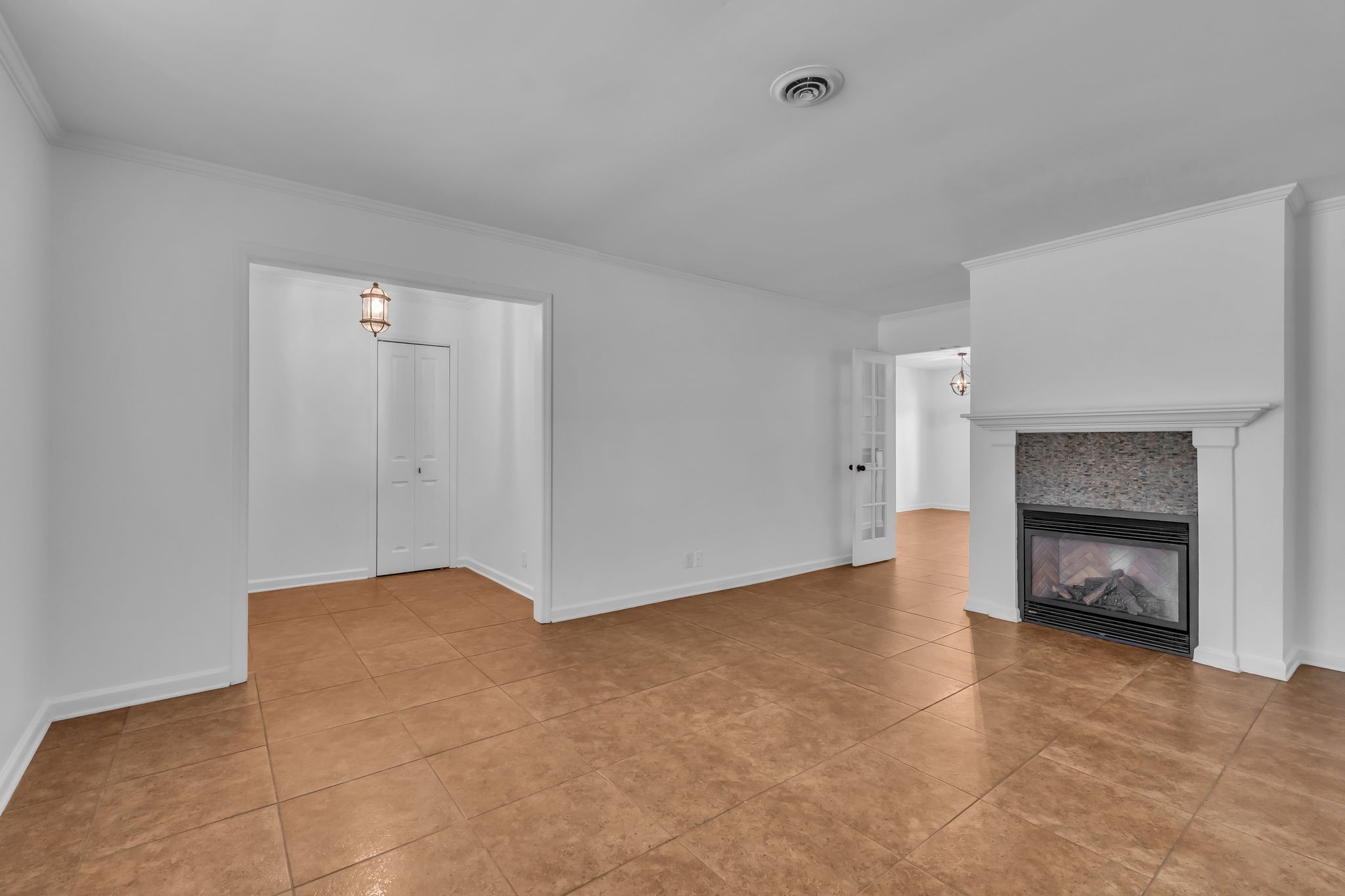 8300 Sawyer Brown Road, Unit M301 Nashville, TN 37221 - Photo 8 of 36 a view of an empty room with a fireplace