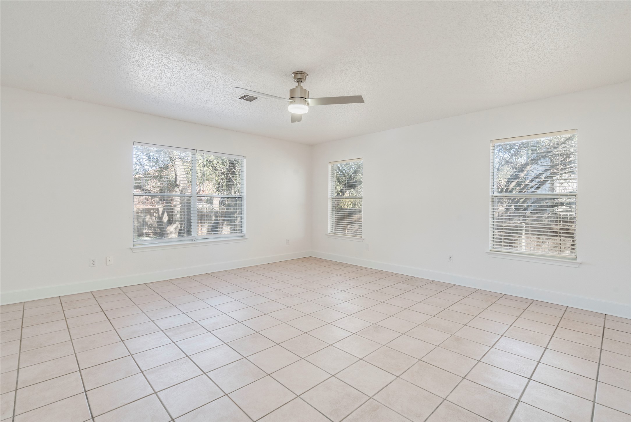 2013 Jasper Lane Cedar Park, TX 78613 - Photo 12 of 25 an empty room with windows and fan