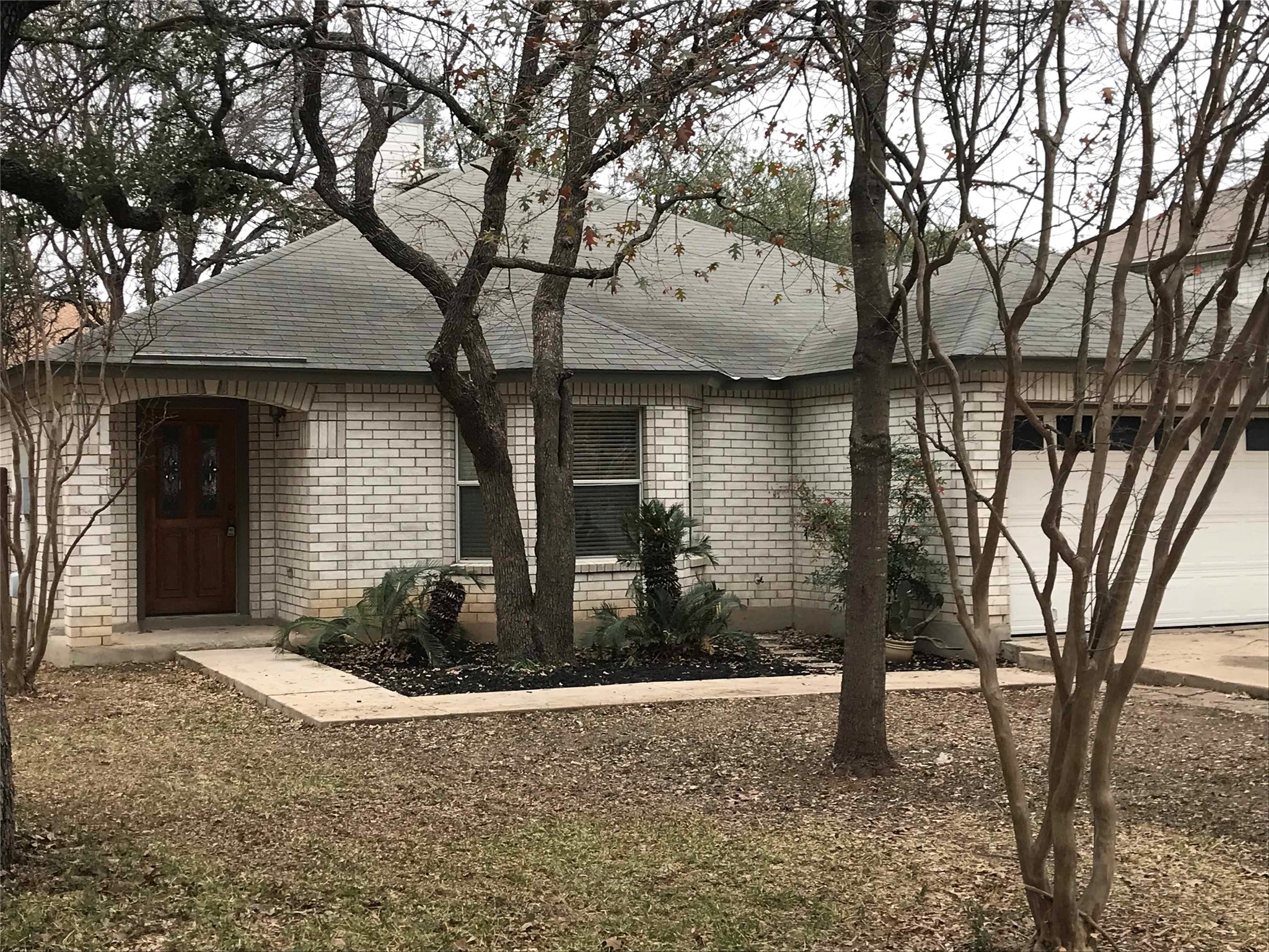 2013 Jasper Lane Cedar Park, TX 78613 - Photo 2 of 25 a front view of a house with garden