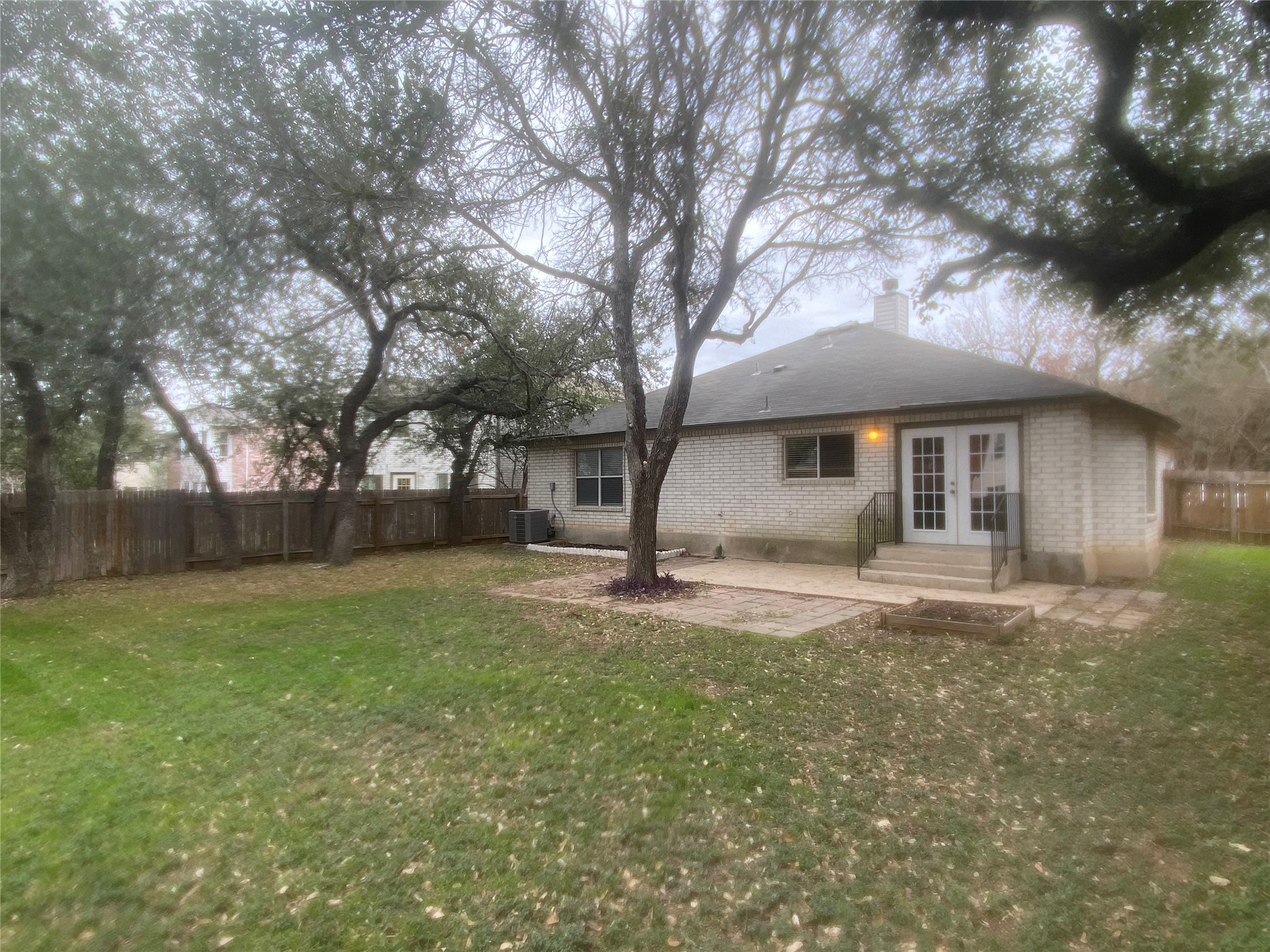 2013 Jasper Lane Cedar Park, TX 78613 - Photo 24 of 25 a front view of a house with a garden