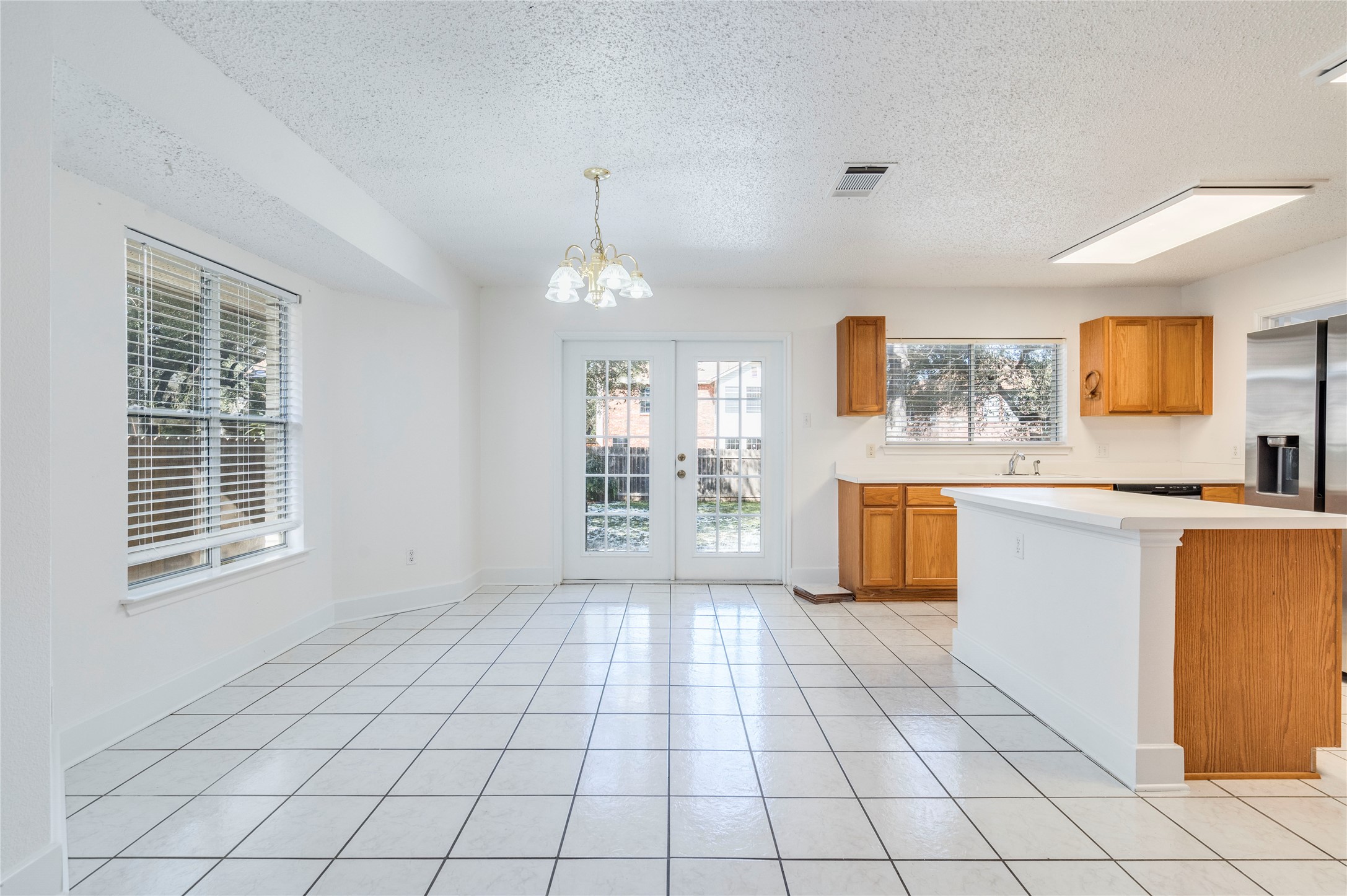 2013 Jasper Lane Cedar Park, TX 78613 - Photo 7 of 25 a view of a kitchen with a sink dishwasher and wooden floor