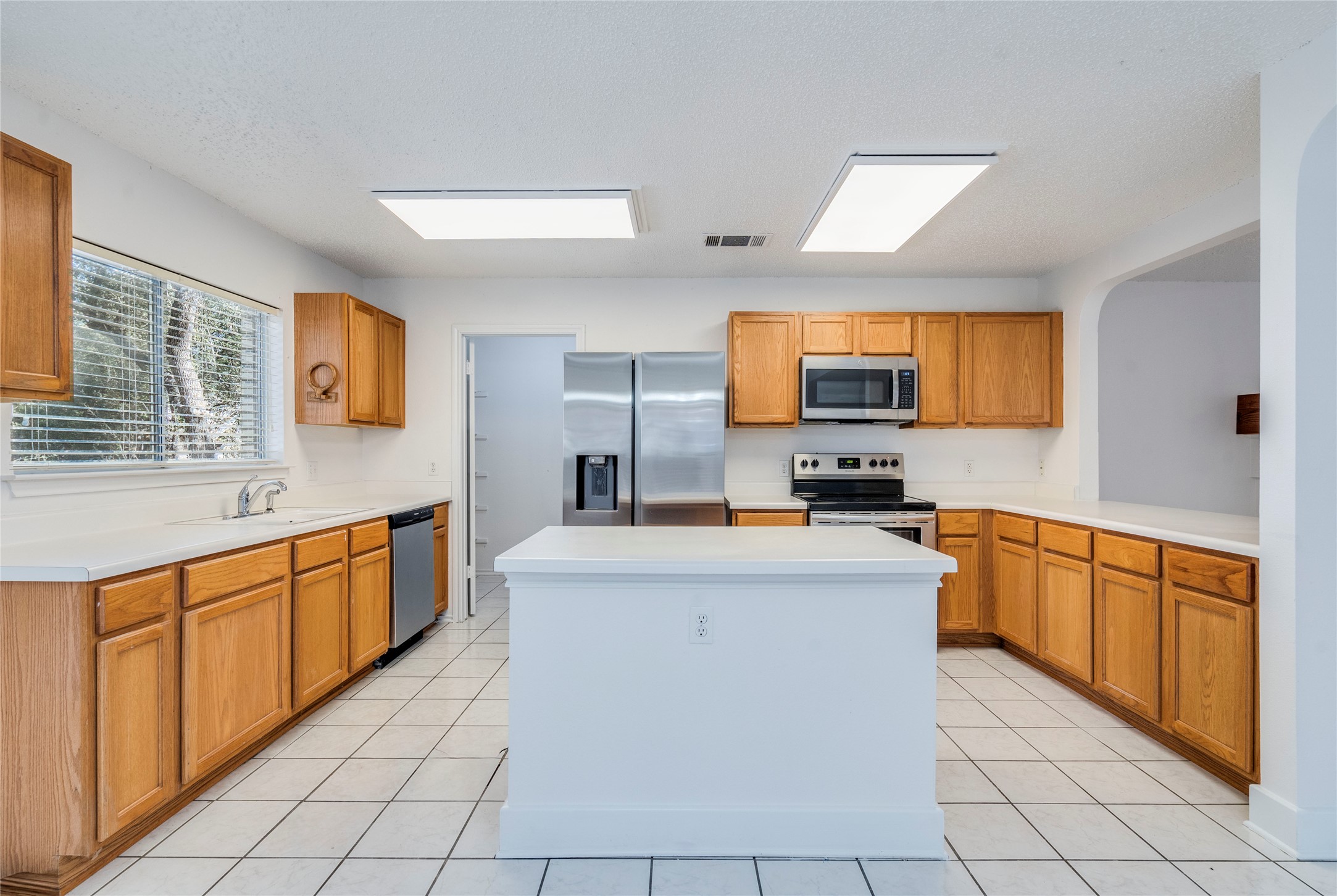 2013 Jasper Lane Cedar Park, TX 78613 - Photo 8 of 25 a large kitchen with stainless steel appliances lots of counter top space