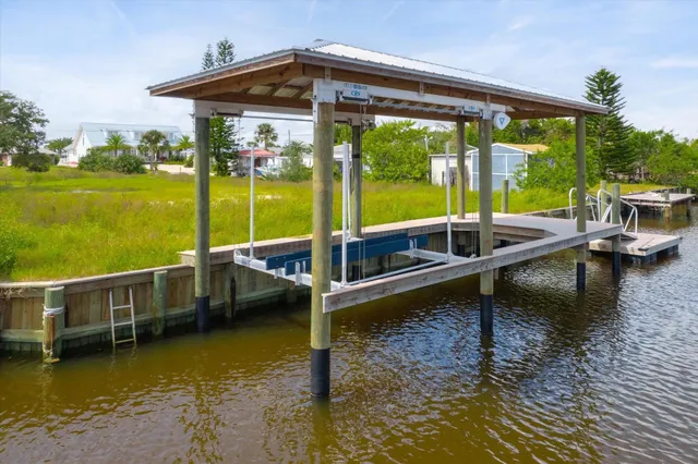 a view of a swimming pool with outdoor seating
