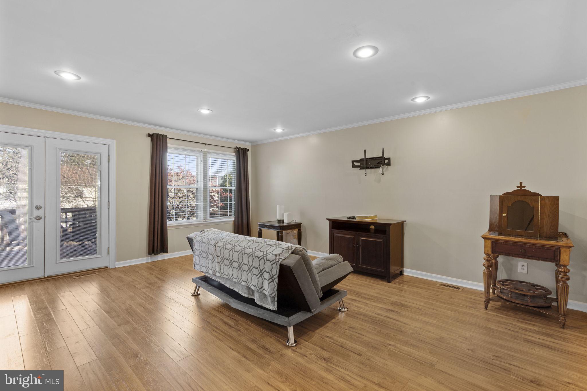 322 Overlea Place Abingdon, MD 21009 - Photo 2 of 27 a living room with a bed furniture and a flat screen tv