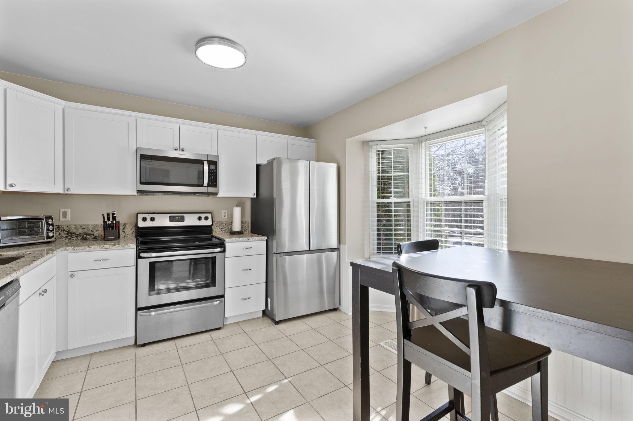 322 Overlea Place Abingdon, MD 21009 - Photo 6 of 27 a kitchen with a stove a sink and a refrigerator