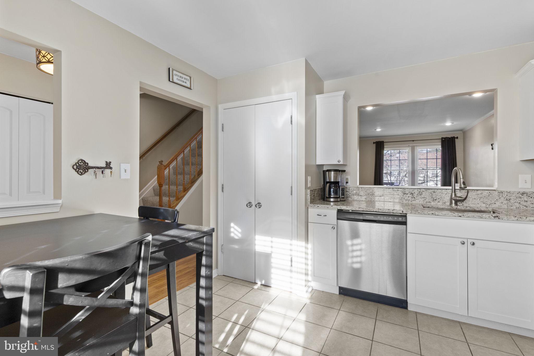 322 Overlea Place Abingdon, MD 21009 - Photo 7 of 27 a kitchen with a sink and chairs
