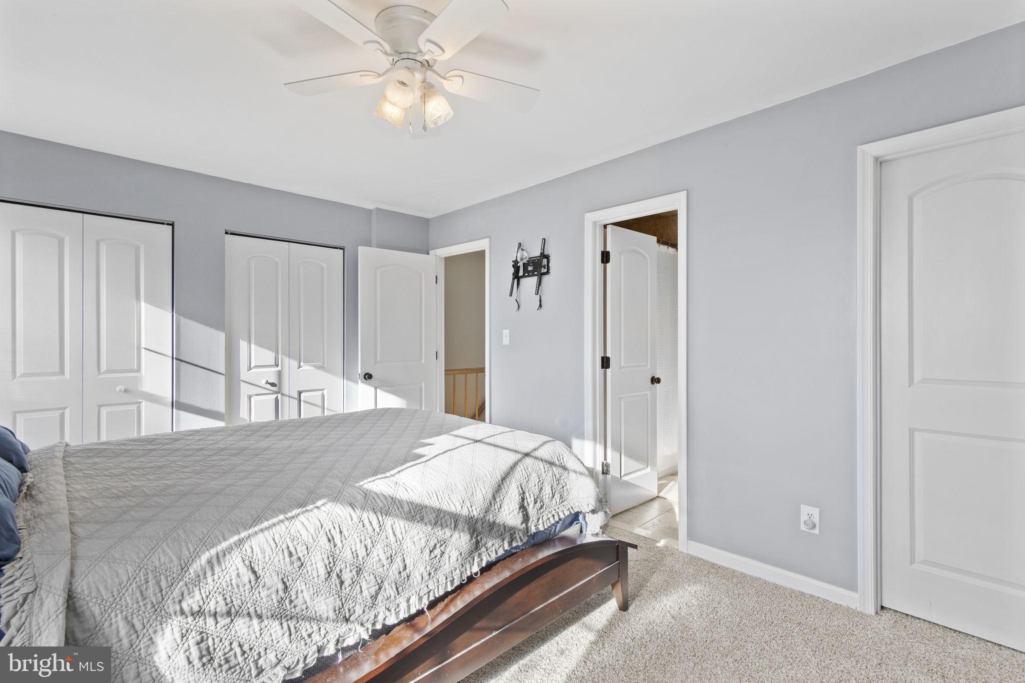 322 Overlea Place Abingdon, MD 21009 - Photo 10 of 27 a bedroom with a large bed and a chandelier