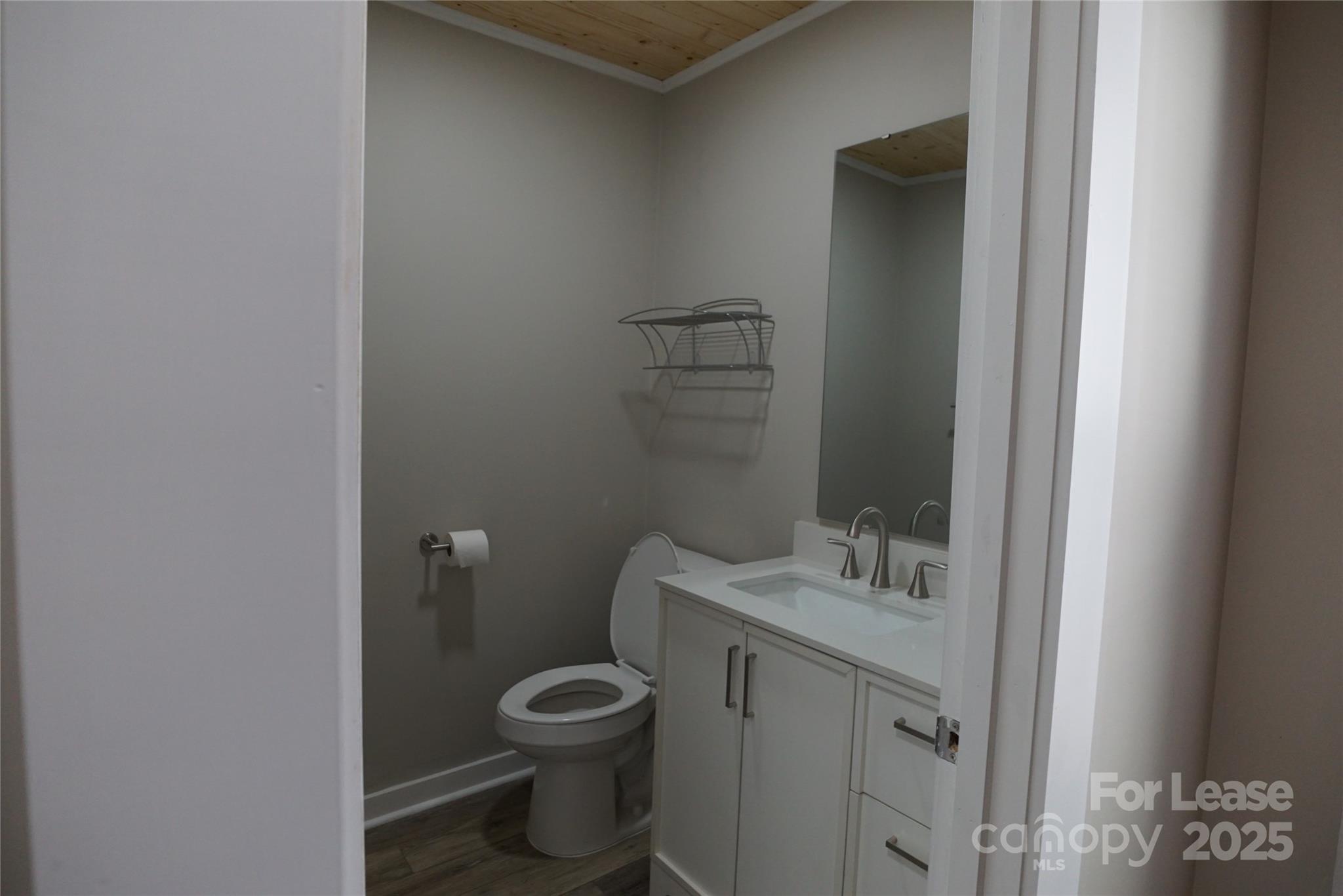 146 Fairway Avenue Hudson, NC 28638 - Photo 9 of 9 a bathroom with a toilet sink and vanity
