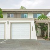 a view of a house with a parking space