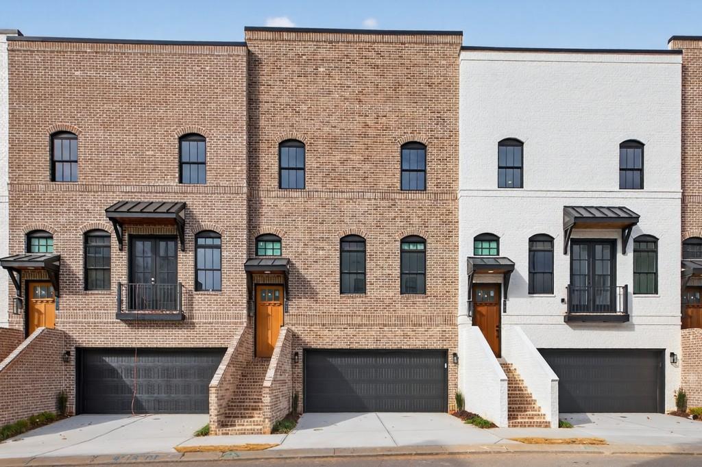 a front view of a house with glass windows