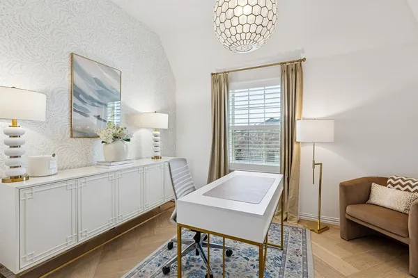 a kitchen with a table chairs and a couch