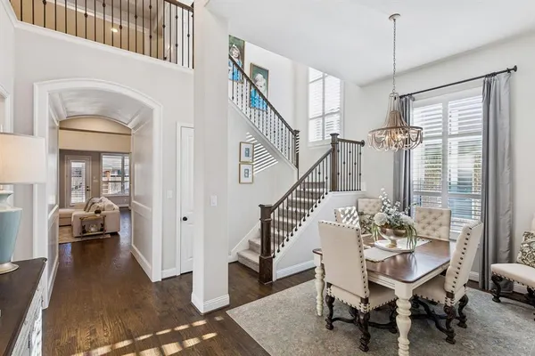 a view of a livingroom with furniture and hardwood floor
