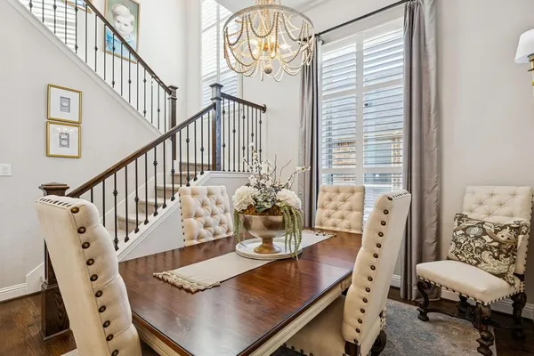 a view of a room with furniture and a chandelier