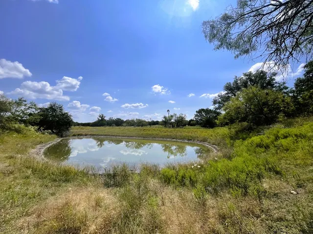 a view of a lake in between of building and lake view