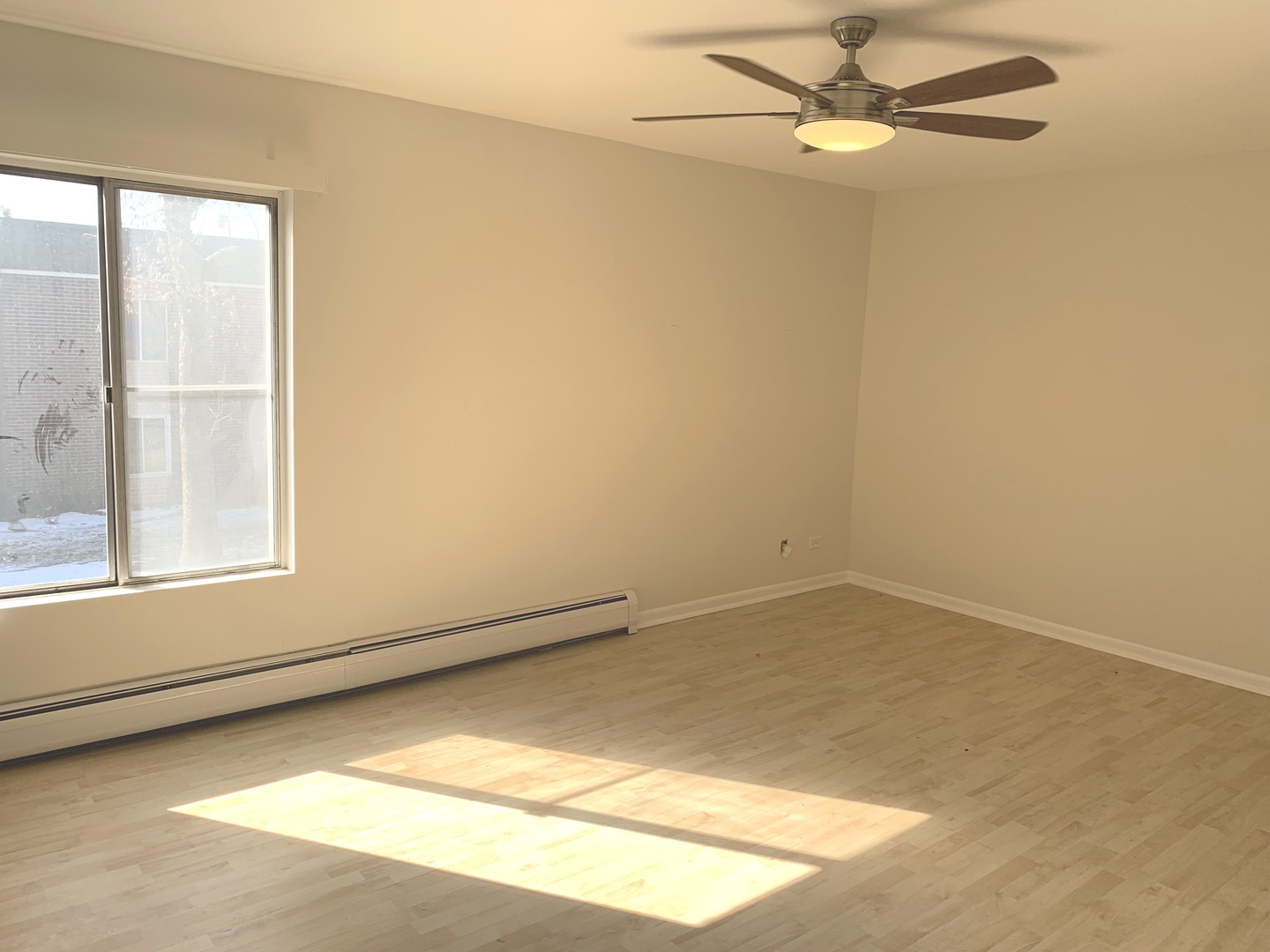 1149 Miller Lane, Unit 212 Buffalo Grove, IL 60089 - Photo 8 of 9 an empty room with a window