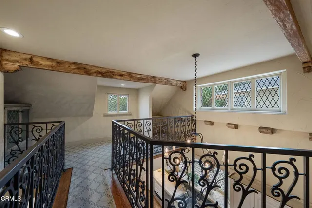 a front view of a house with wooden floor and windows