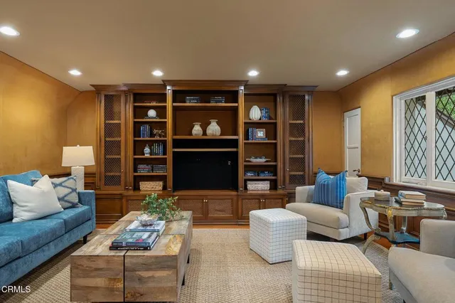 a living room with furniture and a fireplace