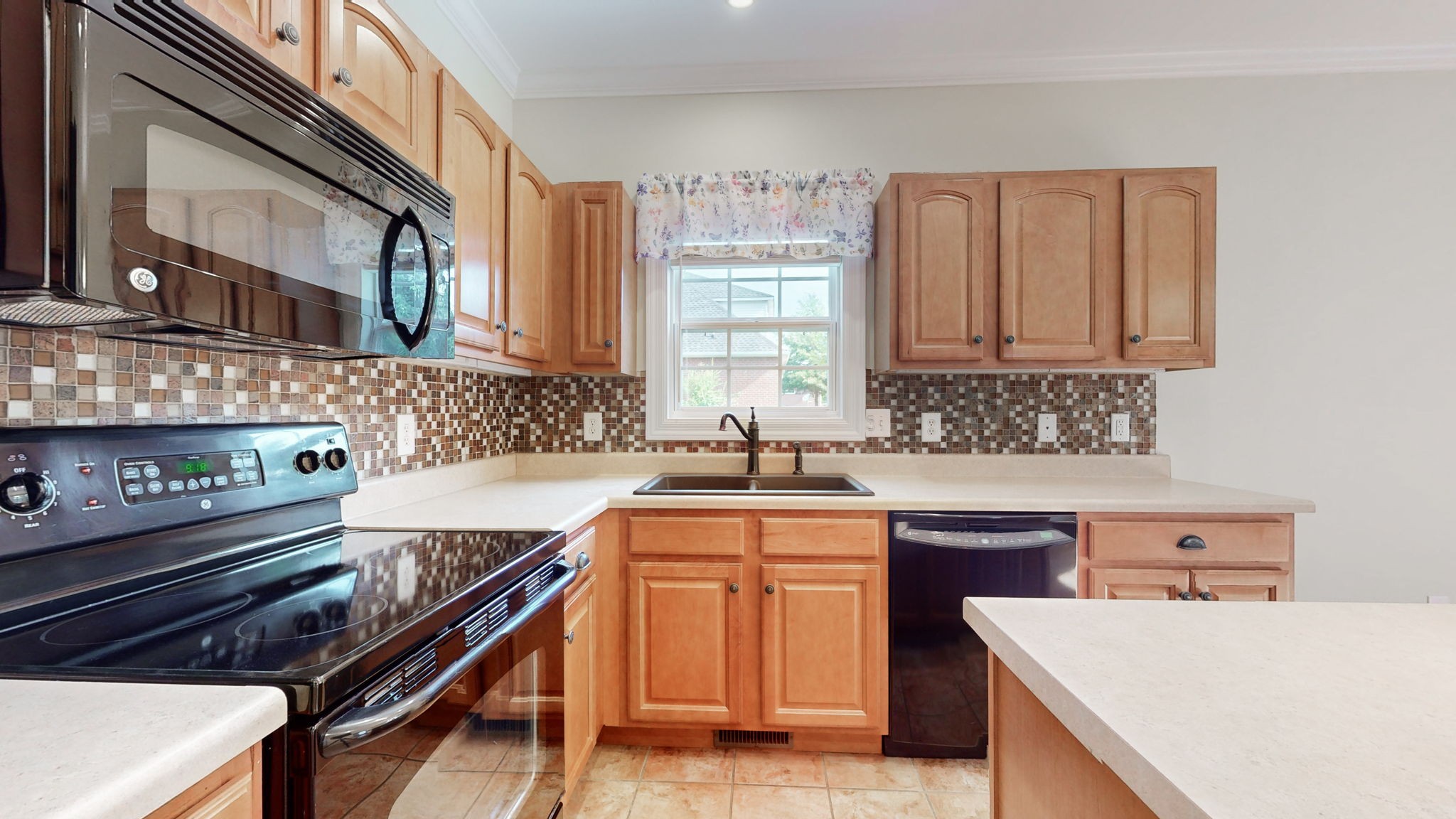 257 Conquest Road Murfreesboro, TN 37128 - Photo 12 of 44 a kitchen that has a sink and a stove