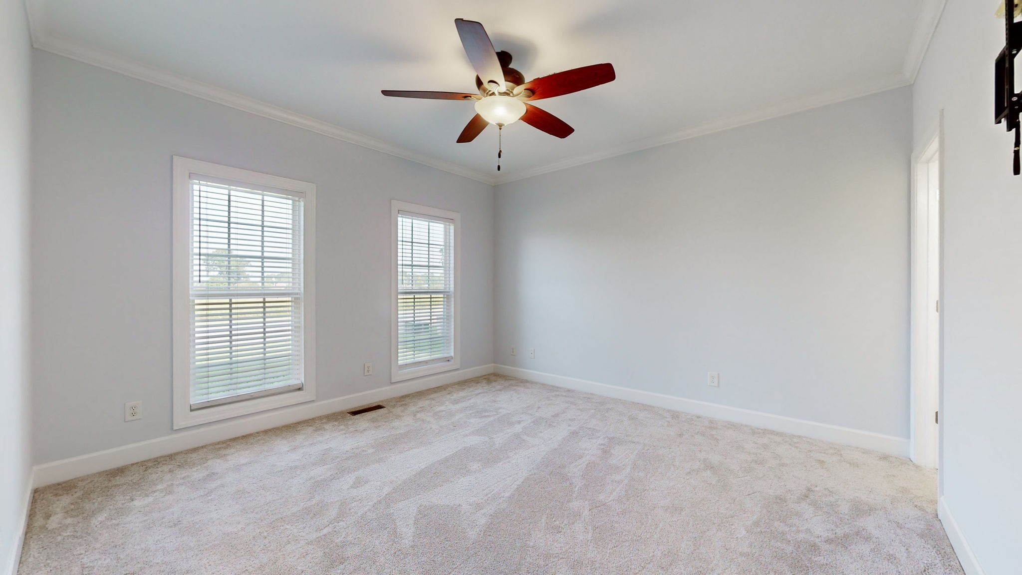 257 Conquest Road Murfreesboro, TN 37128 - Photo 14 of 44 an empty room with ceiling fan and windows