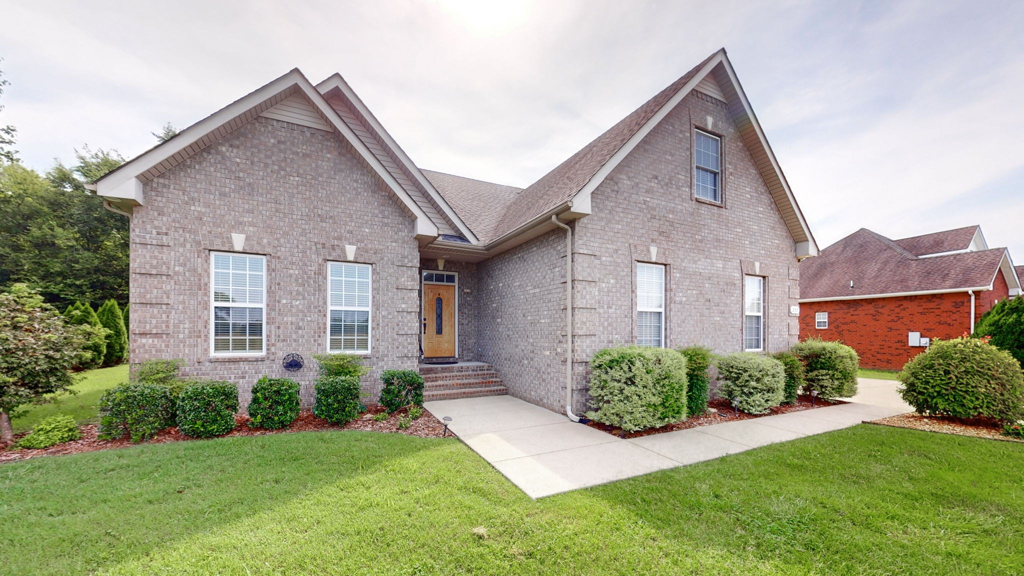 257 Conquest Road Murfreesboro, TN 37128 - Photo 2 of 44 a front view of a house with a garden
