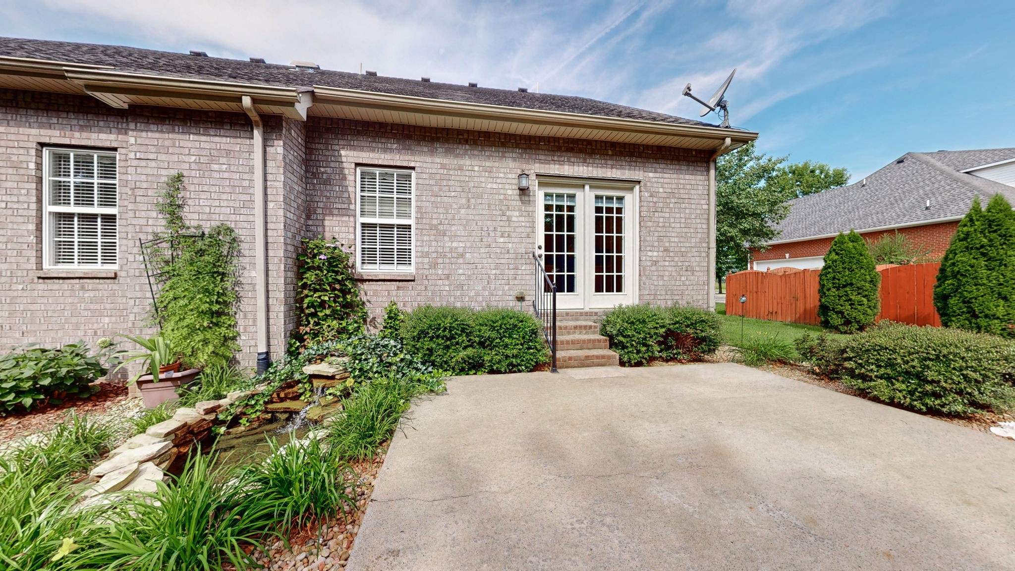 257 Conquest Road Murfreesboro, TN 37128 - Photo 34 of 44 a front view of a house with a yard and potted plants