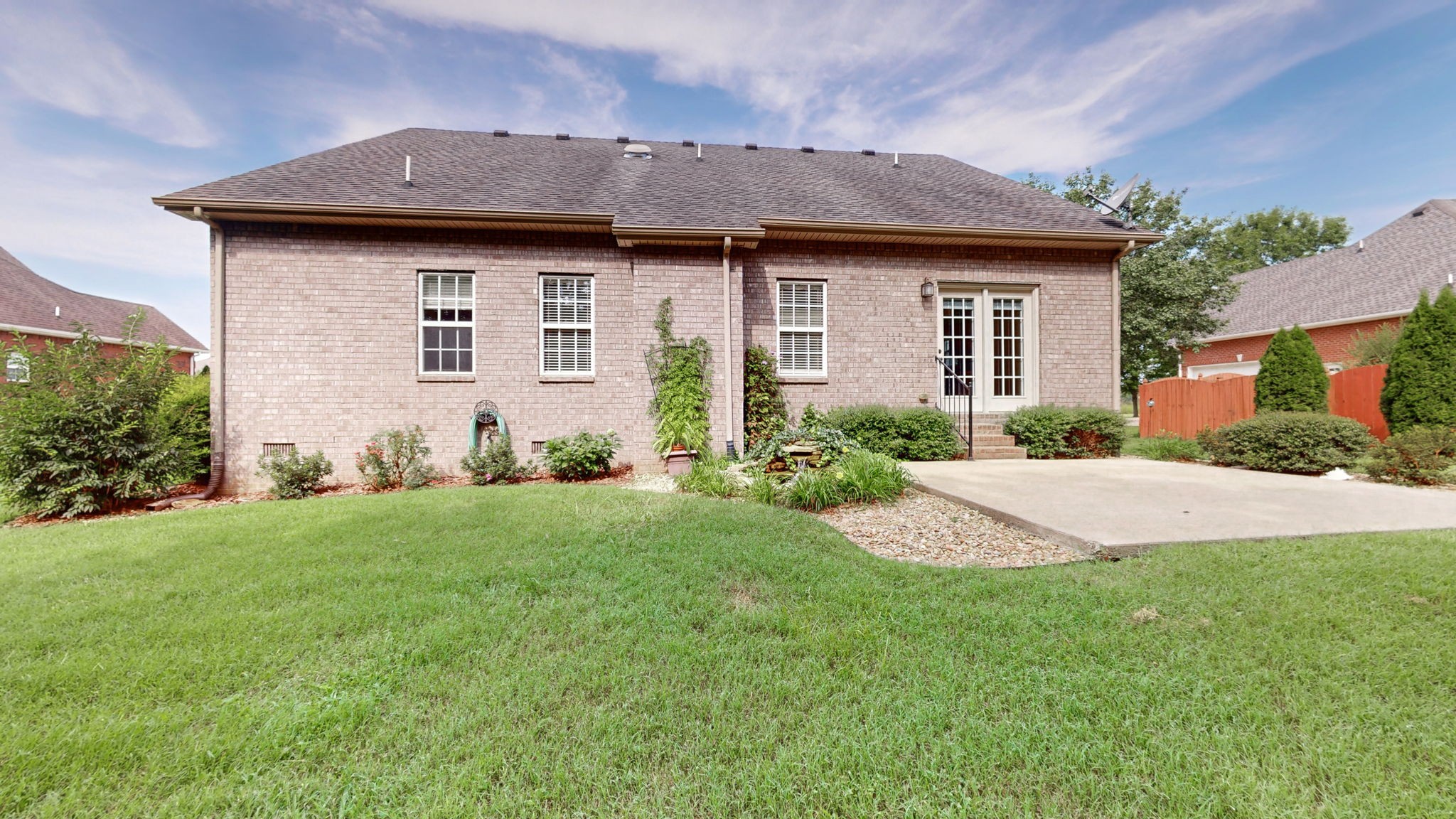 257 Conquest Road Murfreesboro, TN 37128 - Photo 35 of 44 a front view of a house with garden