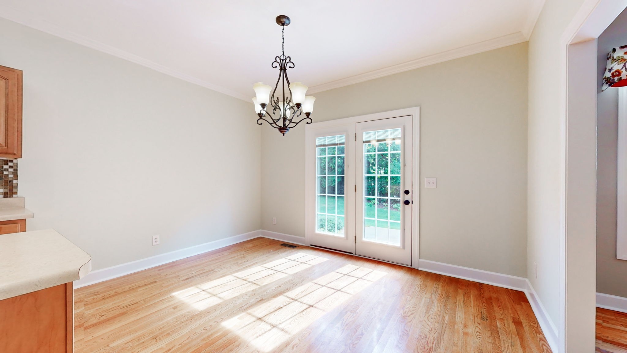 257 Conquest Road Murfreesboro, TN 37128 - Photo 9 of 44 a view of an empty room with wooden floor and a window