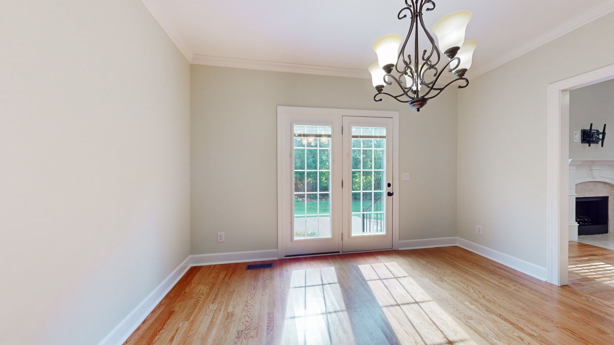 257 Conquest Road Murfreesboro, TN 37128 - Photo 10 of 44 a view of an empty room with wooden floor and a window