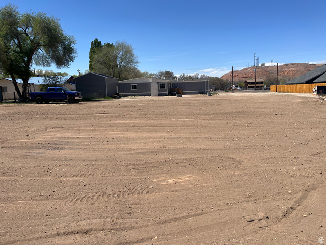 558 North N Cres Road Roosevelt, UT 84066 - Photo 12 of 31 Expansive level lot featuring cleared earth, distant rolling hills, and a clear sky
