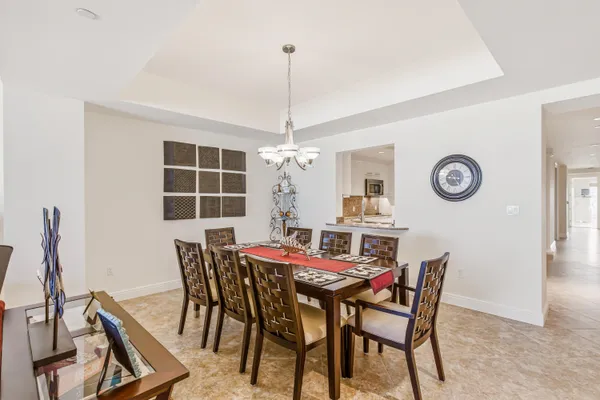 a dining room with furniture and window