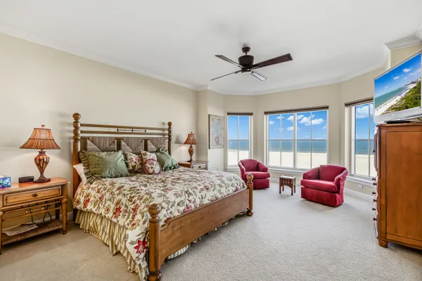 a bedroom with a bed and a couch