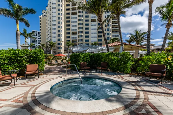 a view of a swimming pool with sitting area
