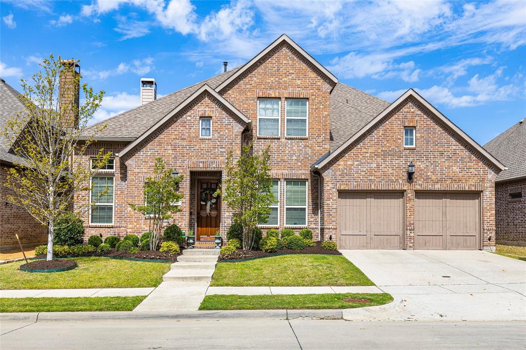 4625 Man O'War Road Carrollton, TX 75010 - Photo 1 of 1 a front view of a house with a yard