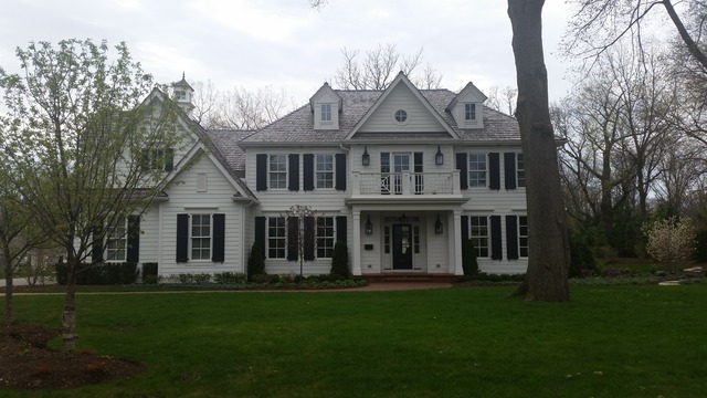 Undisclosed Address Glenview, IL 60025 - Photo 1 of 1 a front view of a house with a garden