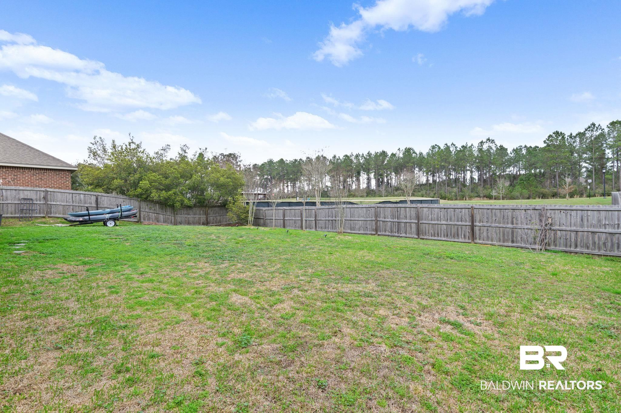 12693 Waxwing Avenue Daphne, AL 36527 - Photo 11 of 43 View of fenced backyard