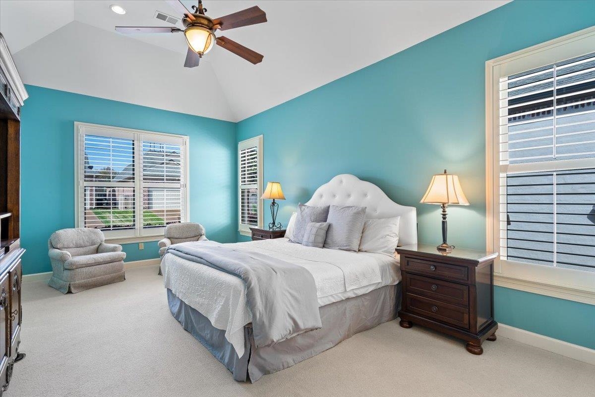 1495 Kimbrough Road Germantown, TN 38138 - Photo 18 of 31 Carpeted bedroom featuring a ceiling fan, baseboards, vaulted ceiling, and visible vents