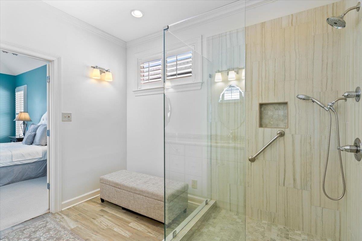 1495 Kimbrough Road Germantown, TN 38138 - Photo 20 of 31 Ensuite bathroom with connected bathroom, a tile shower, ornamental molding, and wood finished floors