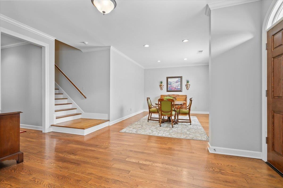 1495 Kimbrough Road Germantown, TN 38138 - Photo 4 of 31 Dining room featuring ornamental molding, stairway, and light wood-type flooring