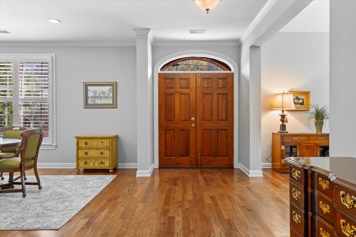 1495 Kimbrough Road Germantown, TN 38138 - Photo 5 of 31 Entryway with baseboards, wood finished floors, and crown molding