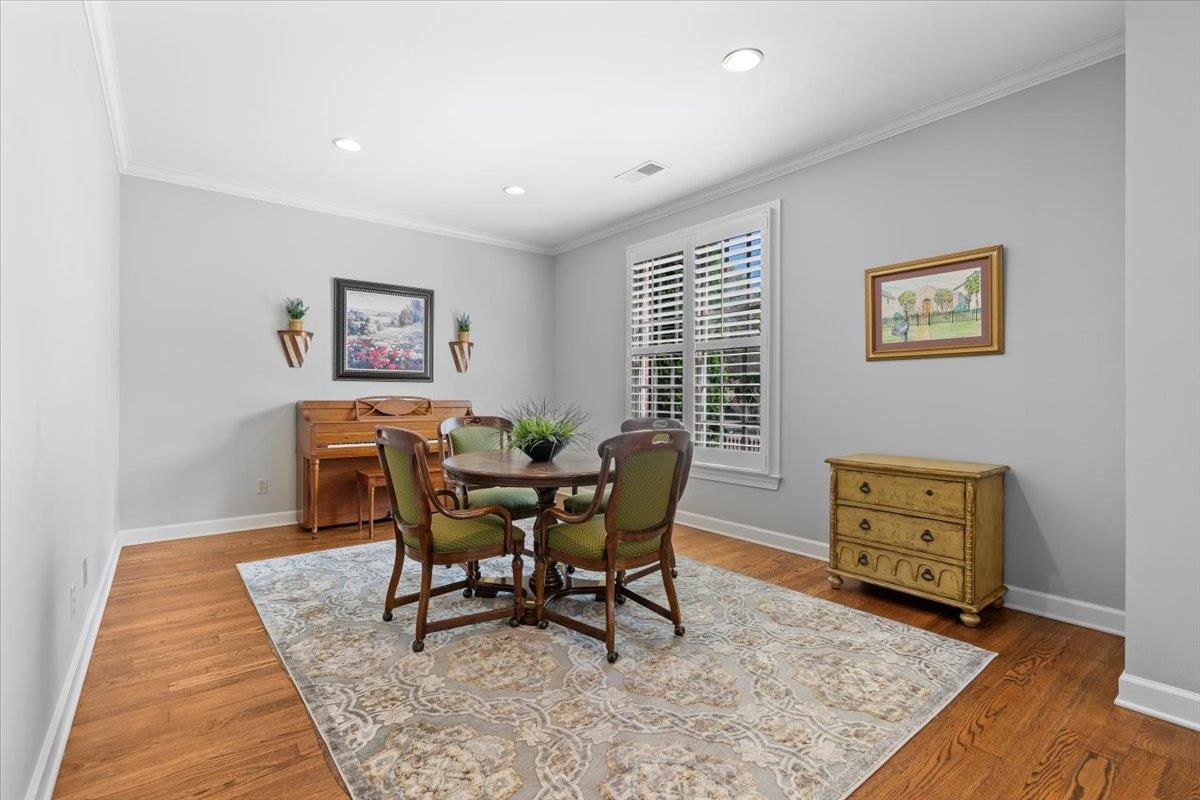 1495 Kimbrough Road Germantown, TN 38138 - Photo 6 of 31 Dining room featuring visible vents, baseboards, ornamental molding, wood finished floors, and recessed lighting