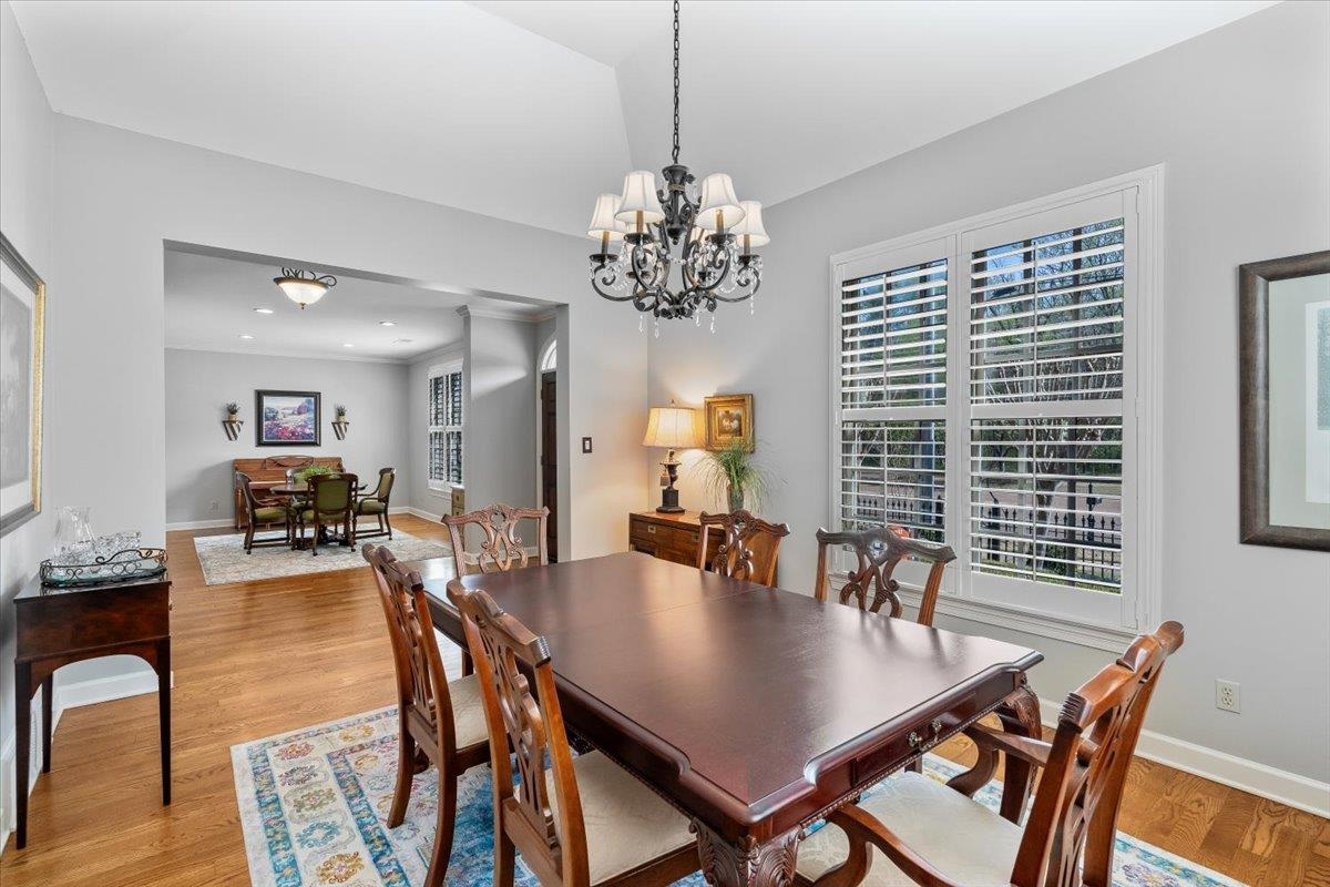 1495 Kimbrough Road Germantown, TN 38138 - Photo 9 of 31 Dining area featuring a notable chandelier, baseboards, light wood-style floors, and recessed lighting