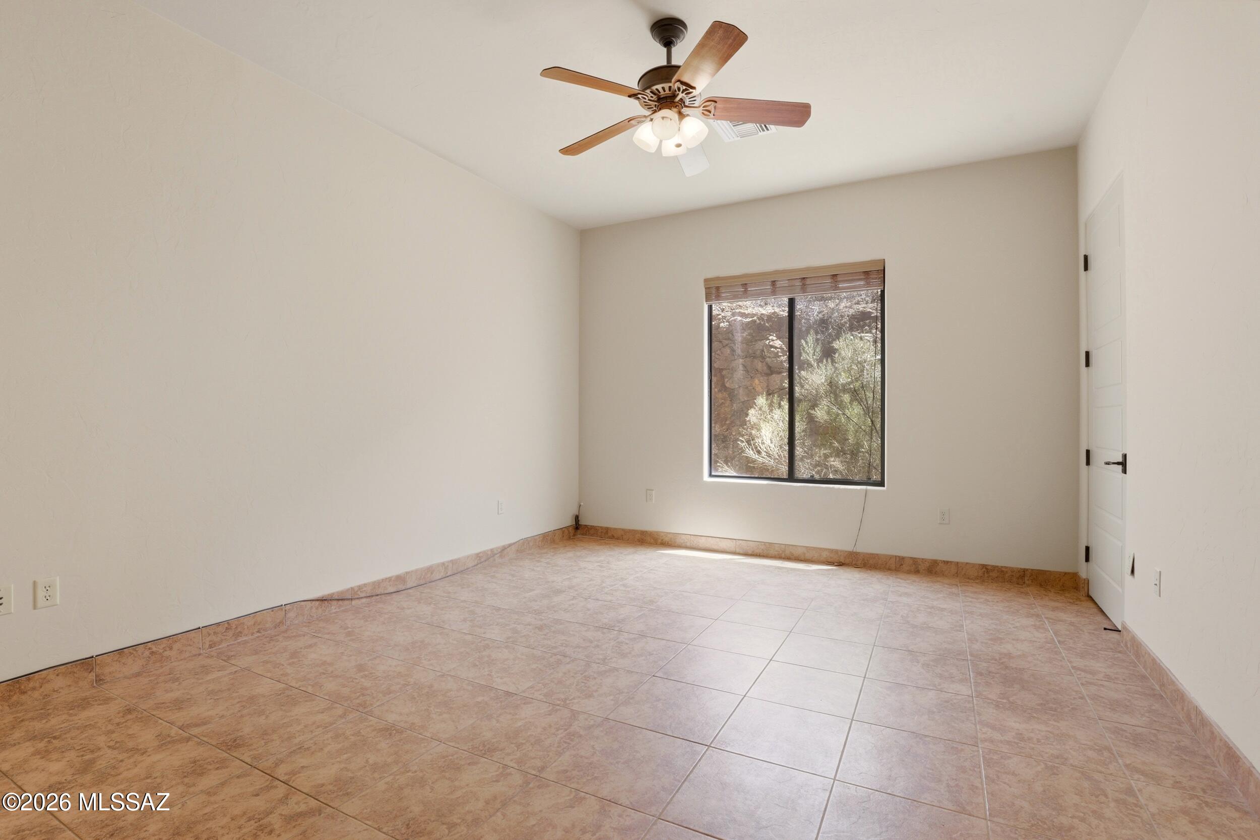6331 West Trails End Road Tucson, AZ 85745 - Photo 19 of 41 a view of an empty room with a window