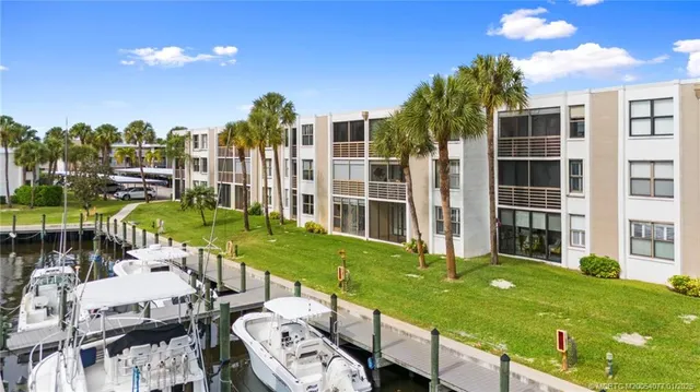 a view of a house with backyard porch and sitting area