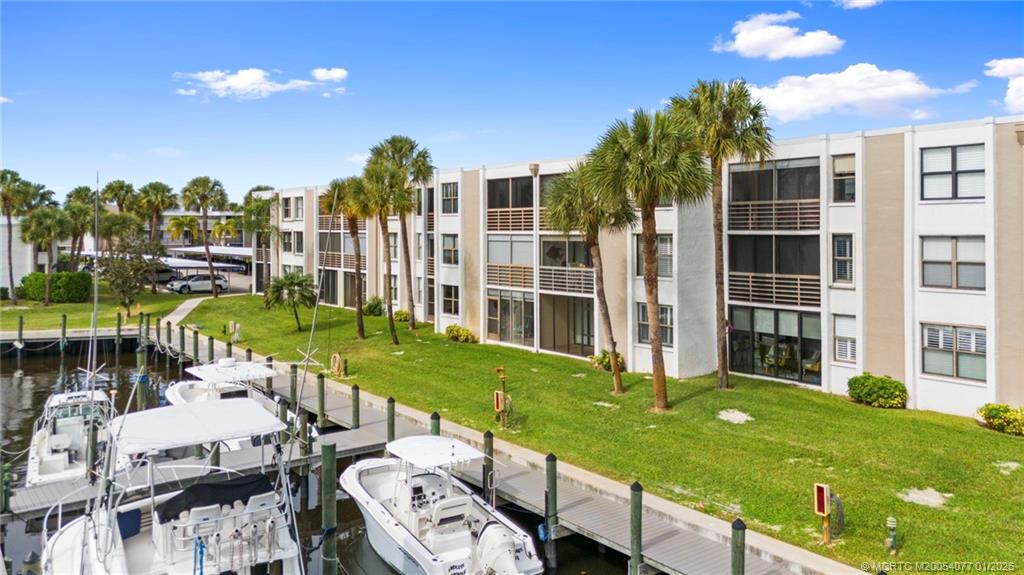 a view of a house with backyard porch and sitting area